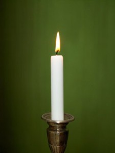 Candle with green background